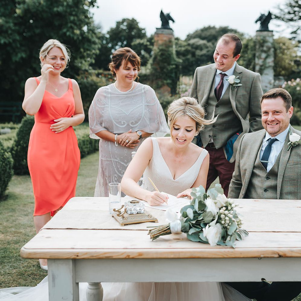 Bride in Phil Collins Bridal Gown for an Outdoor Wedding Ceremony
