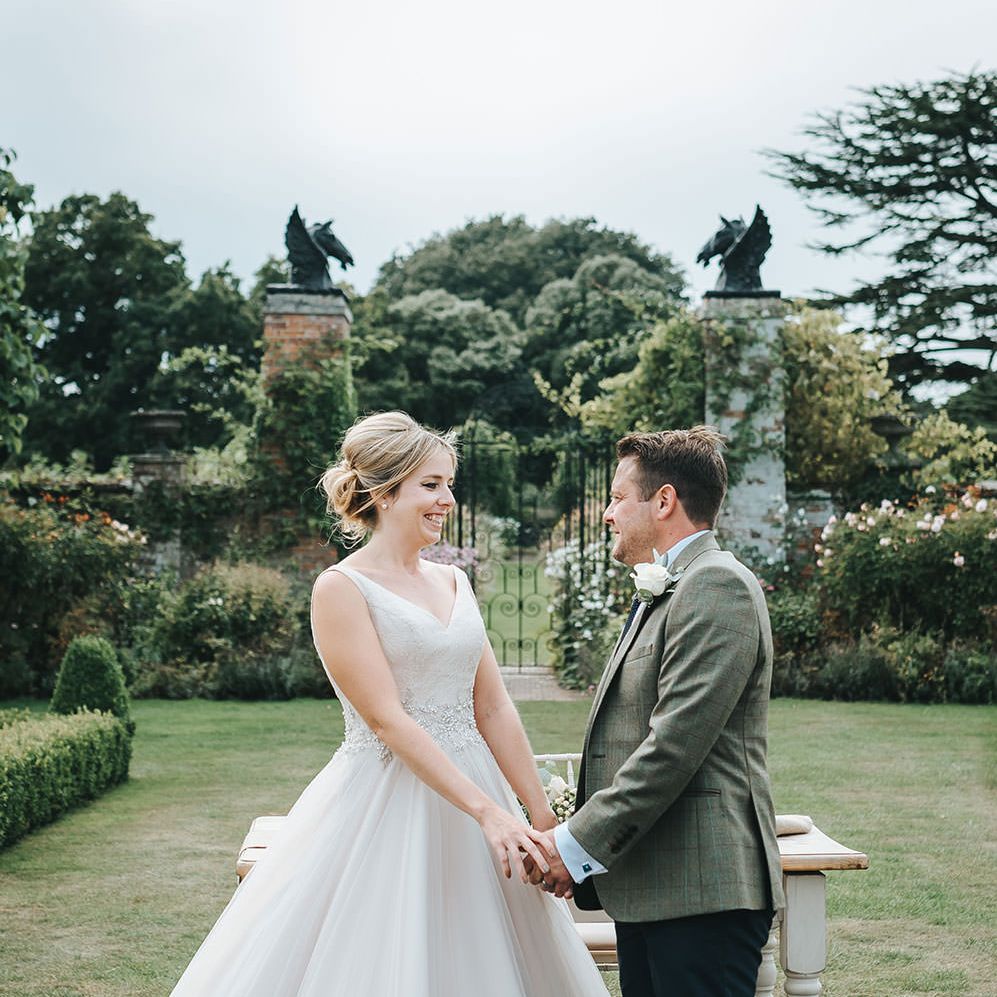 Bride in Phil Collins Bridal Gown for an Outdoor Wedding Ceremony