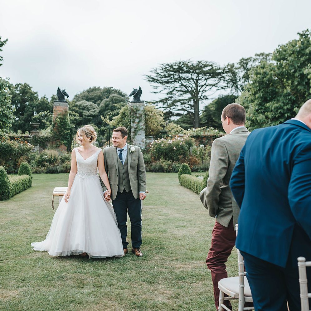 Bride in Phil Collins Bridal Gown for an Outdoor Wedding Ceremony