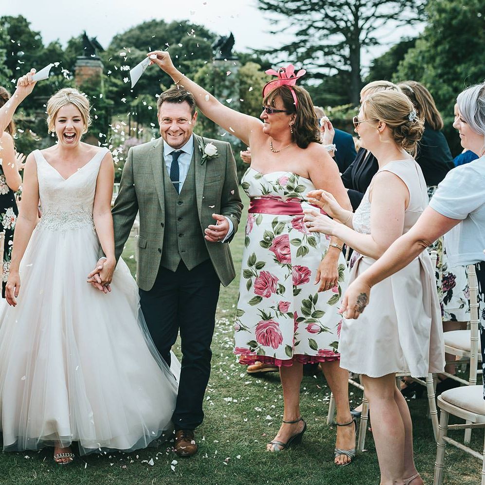 Bride in Phil Collins Bridal Gown for an Outdoor Wedding Ceremony