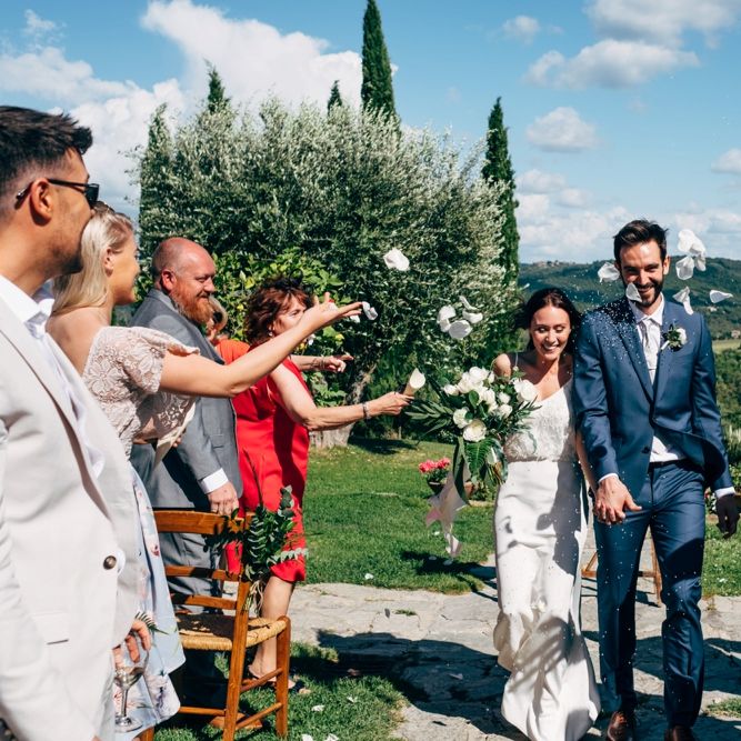 Confetti Moment | Wedding Ceremony | Sarah Seven Wedding Dress | Navy Paul Smith Suit | Outdoor Intimate Wedding at Casa Cornacchi in Tuscany, Italy | Dale Weeks Photography