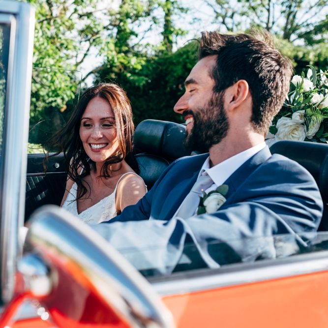 Red Sports Wedding Car | Bride in Sarah Seven Wedding Dress | Groom in Navy Paul Smith Suit | Outdoor Intimate Wedding at Casa Cornacchi in Tuscany, Italy | Dale Weeks Photography