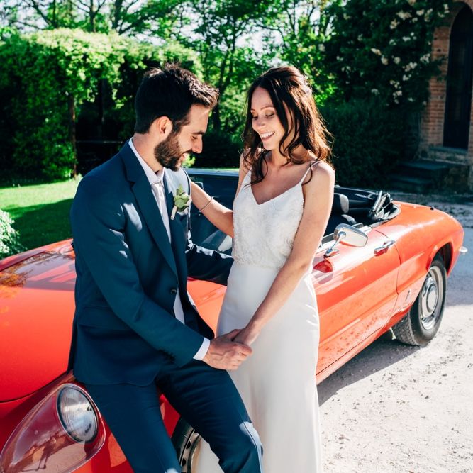 Red Sports Wedding Car | Bride in Sarah Seven Wedding Dress | Groom in Navy Paul Smith Suit | Outdoor Intimate Wedding at Casa Cornacchi in Tuscany, Italy | Dale Weeks Photography
