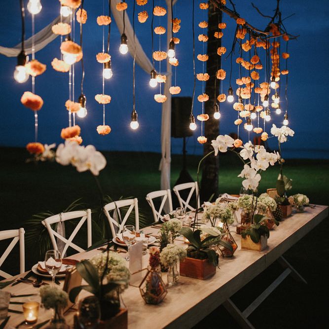 Incredible Outdoor Wedding Reception In Bali With Hanging Florals & Fairy Lights