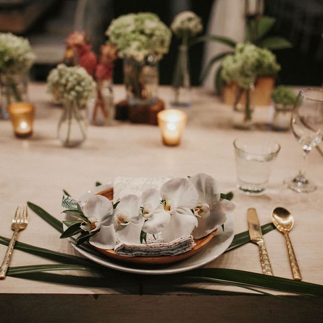 Incredible Outdoor Wedding Reception In Bali With Hanging Florals & Fairy Lights