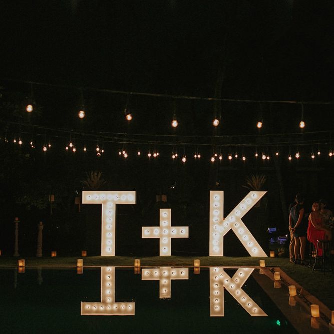 Incredible Outdoor Wedding Reception In Bali With Hanging Florals & Fairy Lights