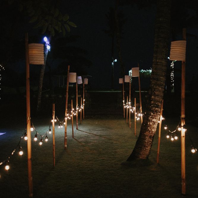 Incredible Outdoor Wedding Reception In Bali With Hanging Florals & Fairy Lights