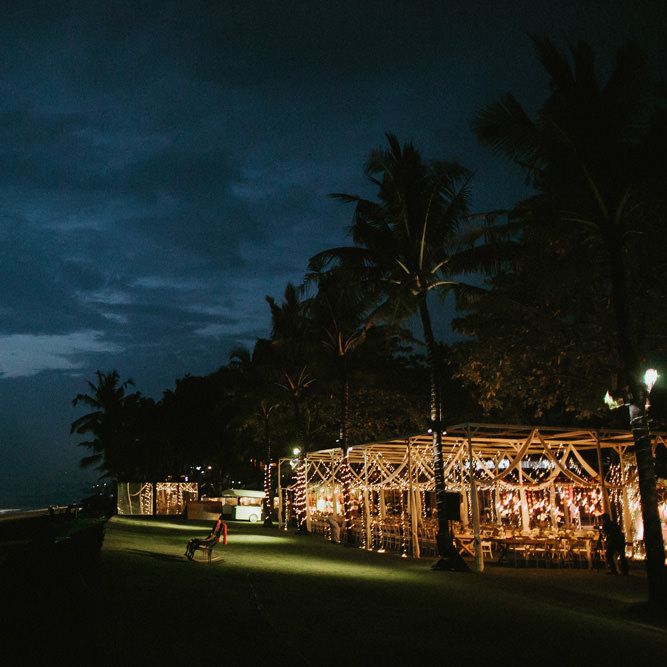 Incredible Outdoor Wedding Reception In Bali With Hanging Florals & Fairy Lights