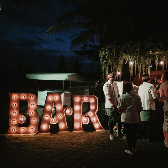 Incredible Outdoor Wedding Reception In Bali With Hanging Florals & Fairy Lights