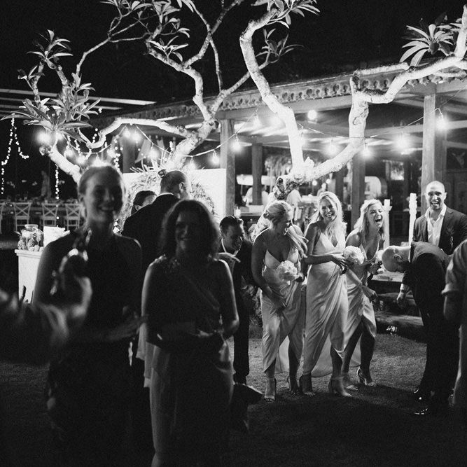 Incredible Outdoor Wedding Reception In Bali With Hanging Florals & Fairy Lights