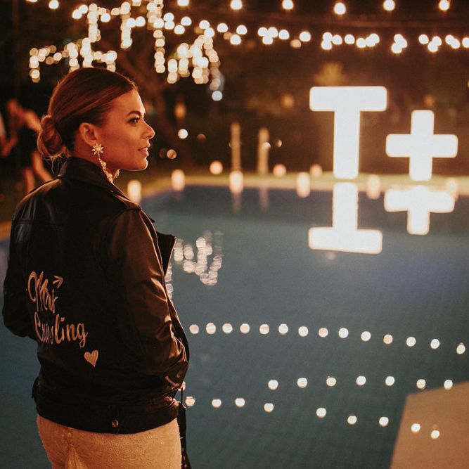 Incredible Outdoor Wedding Reception In Bali With Hanging Florals & Fairy Lights