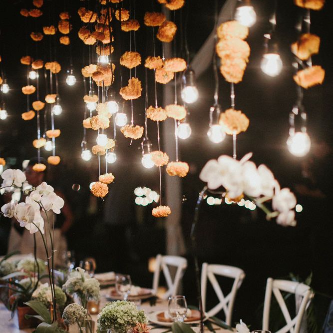 Incredible Outdoor Wedding Reception In Bali With Hanging Florals & Fairy Lights