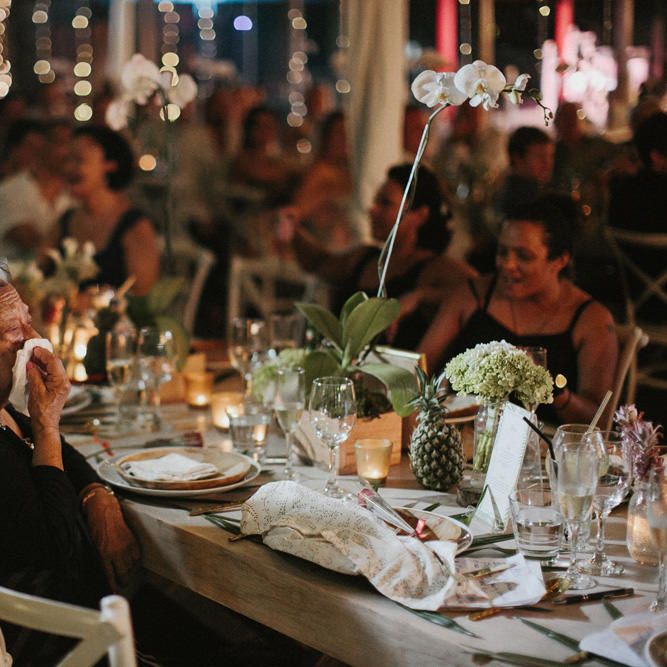 Incredible Outdoor Wedding Reception In Bali With Hanging Florals & Fairy Lights