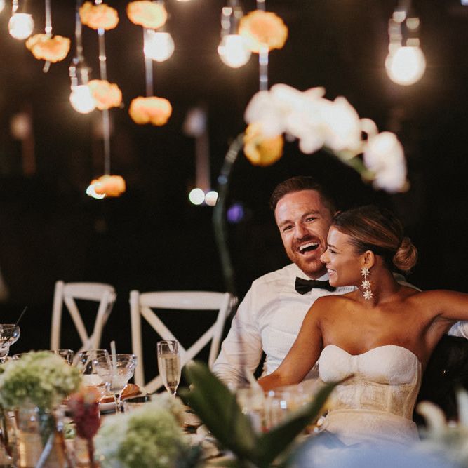 Incredible Outdoor Wedding Reception In Bali With Hanging Florals & Fairy Lights