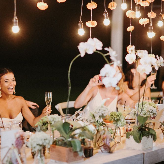 Incredible Outdoor Wedding Reception In Bali With Hanging Florals & Fairy Lights