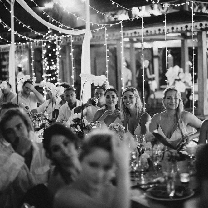 Incredible Outdoor Wedding Reception In Bali With Hanging Florals & Fairy Lights