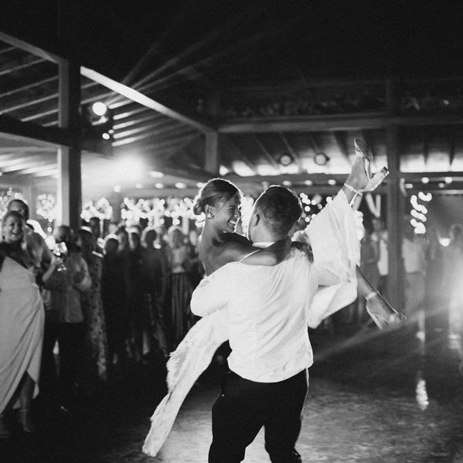Incredible Outdoor Wedding Reception In Bali With Hanging Florals & Fairy Lights