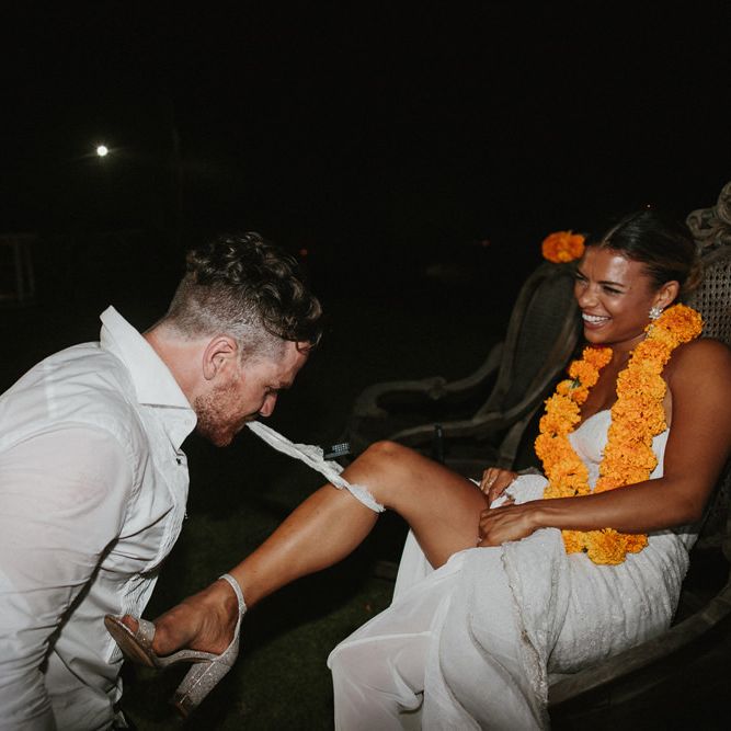 Incredible Outdoor Wedding Reception In Bali With Hanging Florals & Fairy Lights