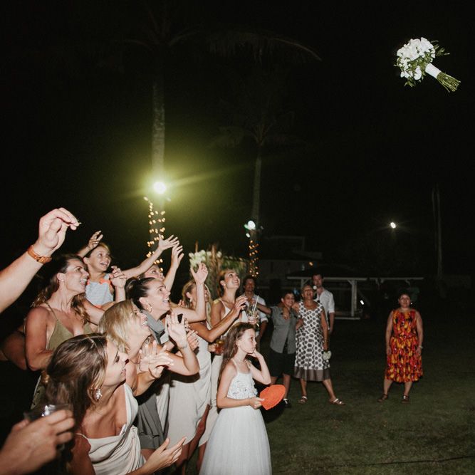 Incredible Outdoor Wedding Reception In Bali With Hanging Florals & Fairy Lights