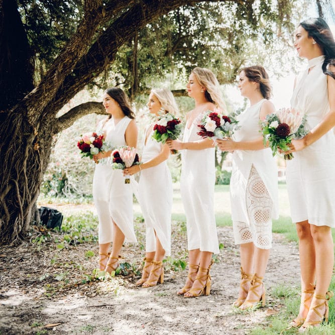 White Bridesmaid Dresses | Deep Red Protea Bouquets