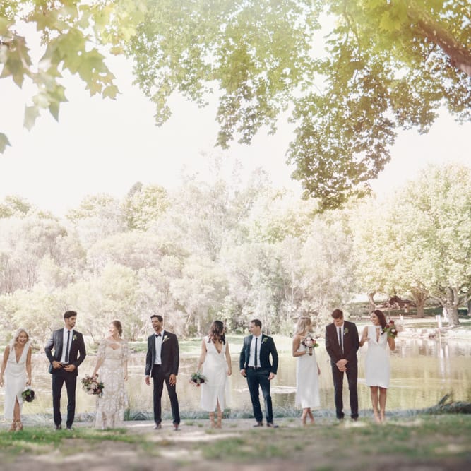 Stylish Wedding Party | White Bridesmaid Dresses | Groomsmen in Tuxedos