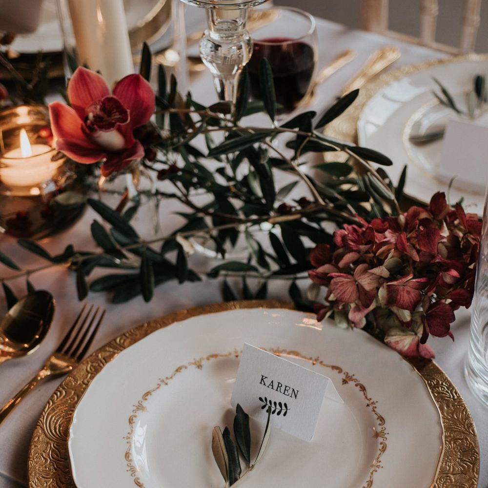 Opulent Place Setting In Reds And Golds Winter Wedding