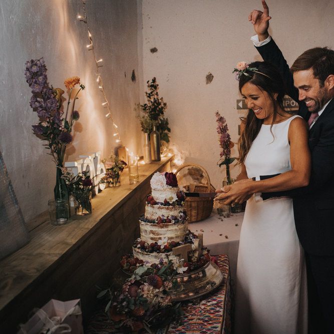 Bride & Groom Cutting The Cake