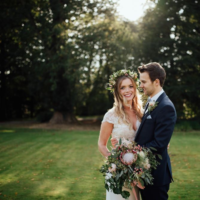 Bride in Bespoke Suzanne Neville Scarlett Bridal Gown | Groom in Herbie Frogg Suit & Liberty Print Mrs Bow Tie | The Lou's Photography