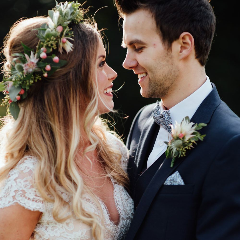 Bride in Bespoke Suzanne Neville Scarlett Bridal Gown | Groom in Herbie Frogg Suit & Liberty Print Mrs Bow Tie | The Lou's Photography