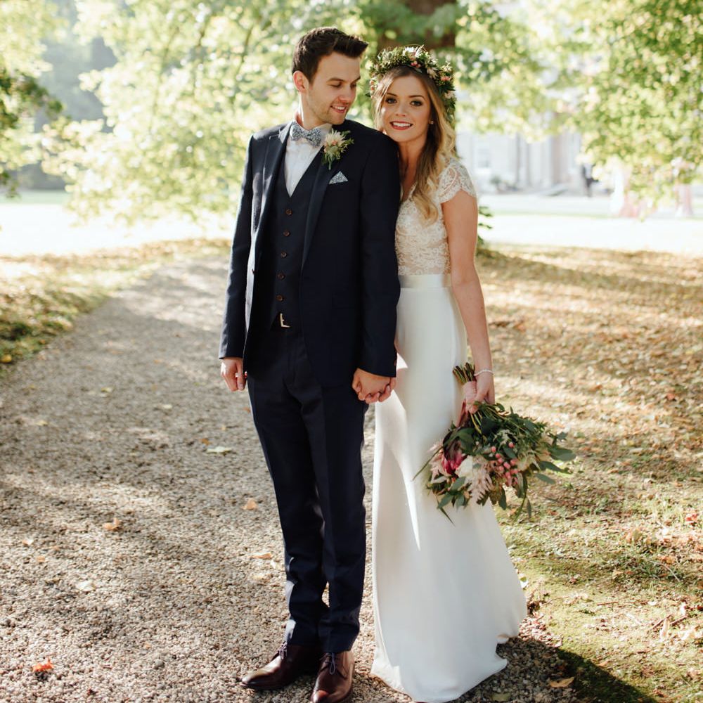 Bride in Bespoke Suzanne Neville Scarlett Bridal Gown | Groom in Herbie Frogg Suit & Liberty Print Mrs Bow Tie | The Lou's Photography