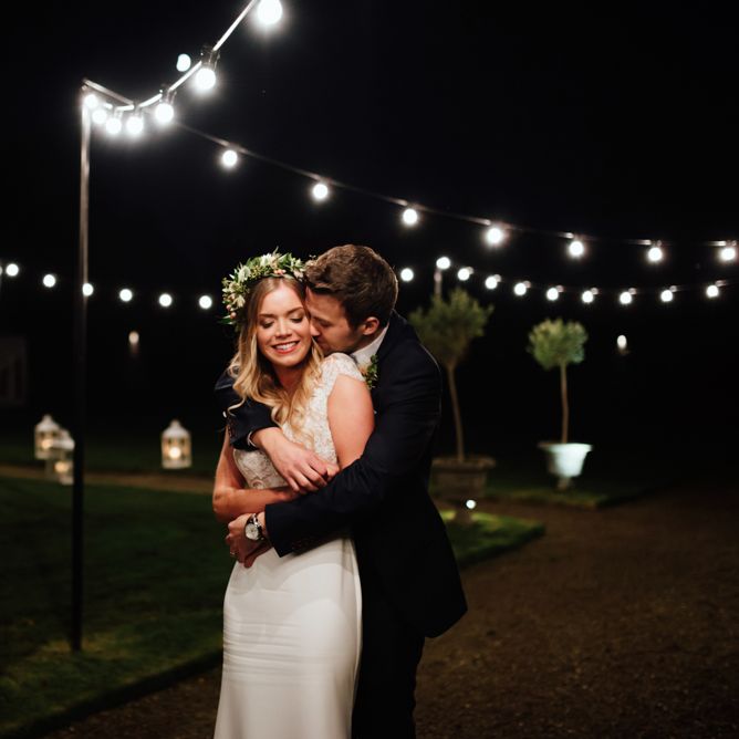Festoon Lights | Bride in Bespoke Suzanne Neville Scarlett Bridal Gown | Groom in Herbie Frogg Suit & Liberty Print Mrs Bow Tie | The Lou's Photography