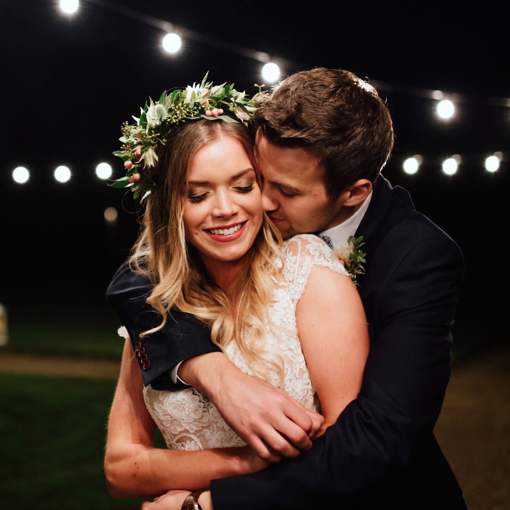 Festoon Lights | Bride in Bespoke Suzanne Neville Scarlett Bridal Gown | Groom in Herbie Frogg Suit & Liberty Print Mrs Bow Tie | The Lou's Photography
