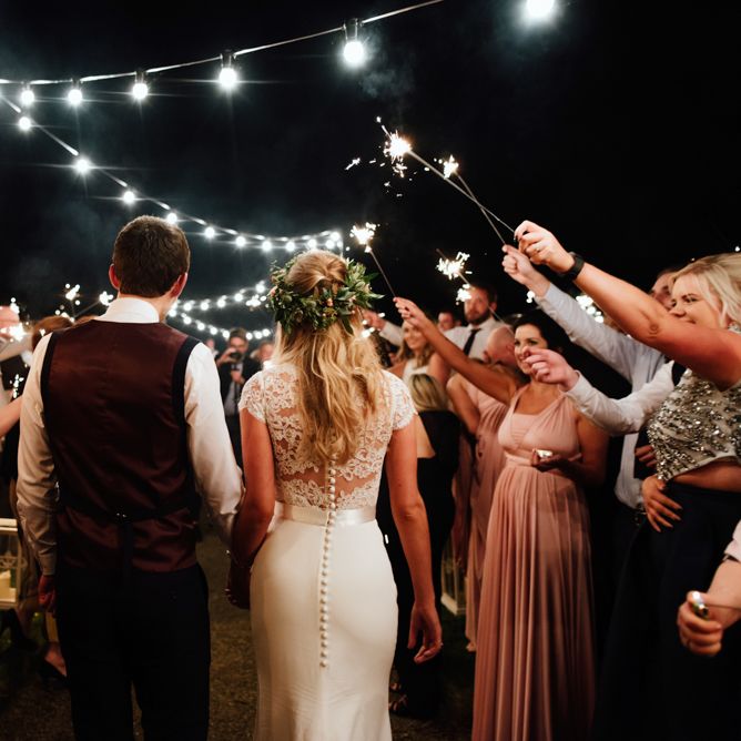 Sparkler Exit | Bride in Bespoke Suzanne Neville Scarlett Bridal Gown | Groom in Herbie Frogg Suit & Liberty Print Mrs Bow Tie | The Lou's Photography