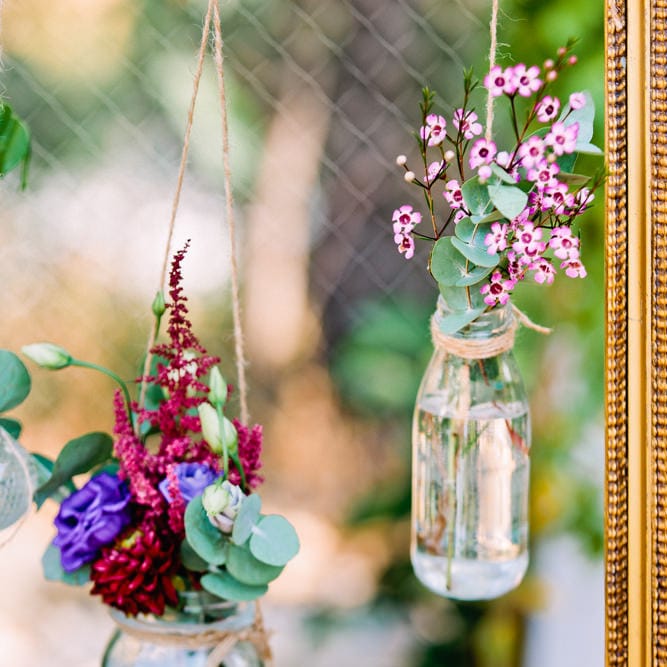 Hanging Bottles with Flowers | Wedding Decor | Jewel Coloured Spanish Wedding Planned & Styled by Rachel Rose Weddings | Anna Gazda Photography