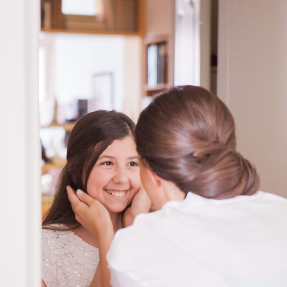 Bride Getting Ready with Flower Girl