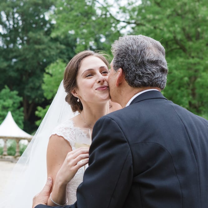 Wedding Guests Hugs | Bride in Ingrida Bridal Gown | Beautiful Classic Wedding at Cornwell Manor | Lucy Davenport Photography