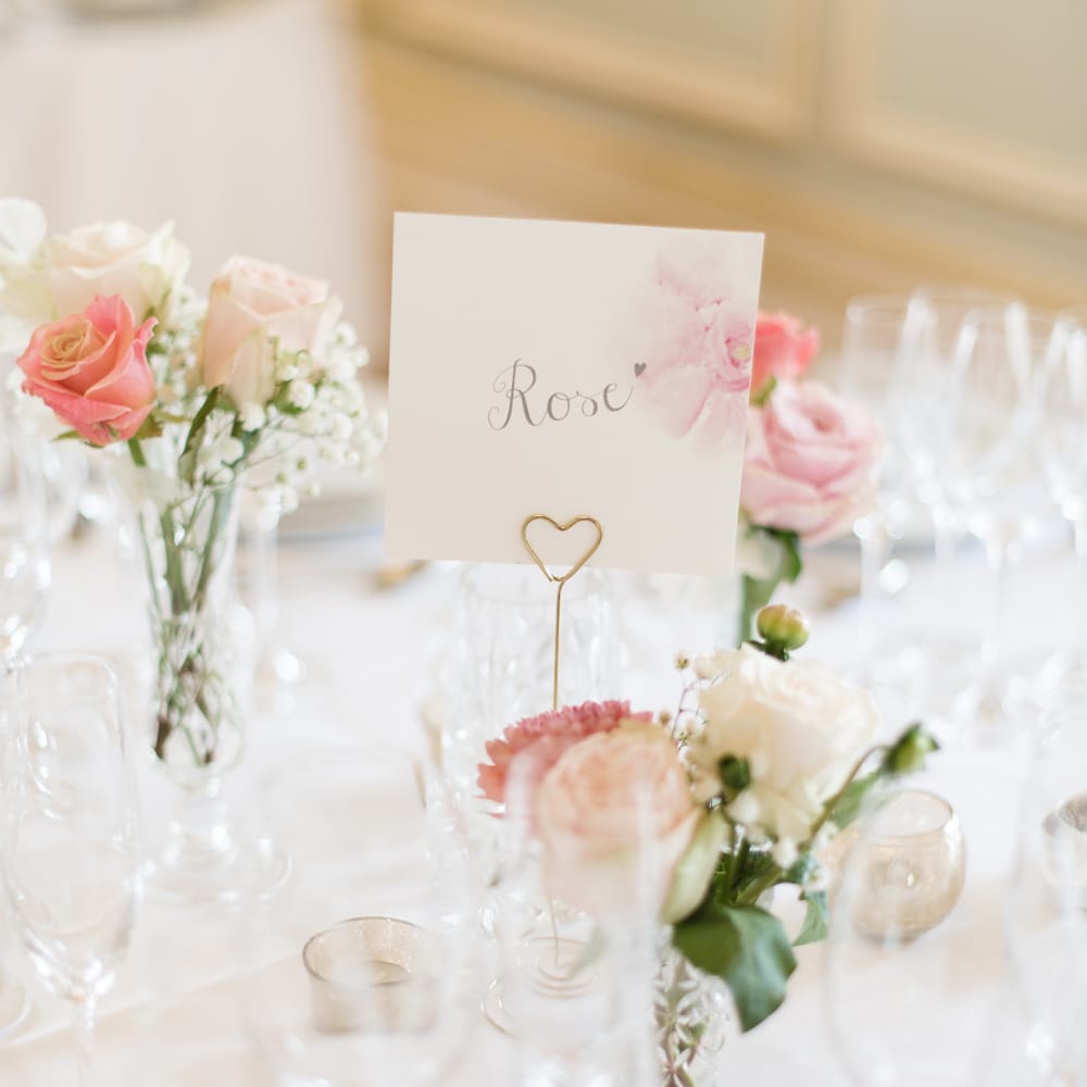 Flower Table Names & Pink Flower Stems in Bud Vases as Centrepieces