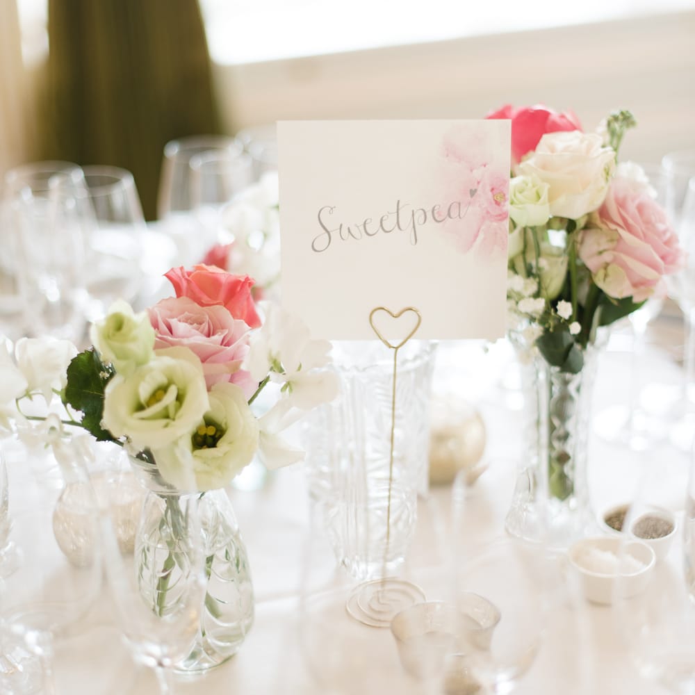 Flower Table Names & Pink Flower Stems in Bud Vases as Centrepieces
