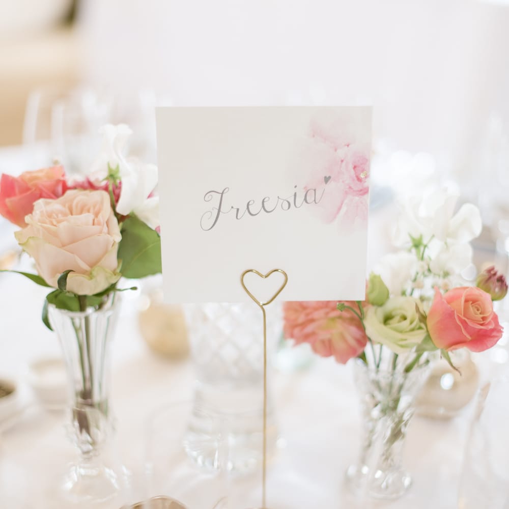 Flower Table Names & Pink Flower Stems in Bud Vases as Centrepieces