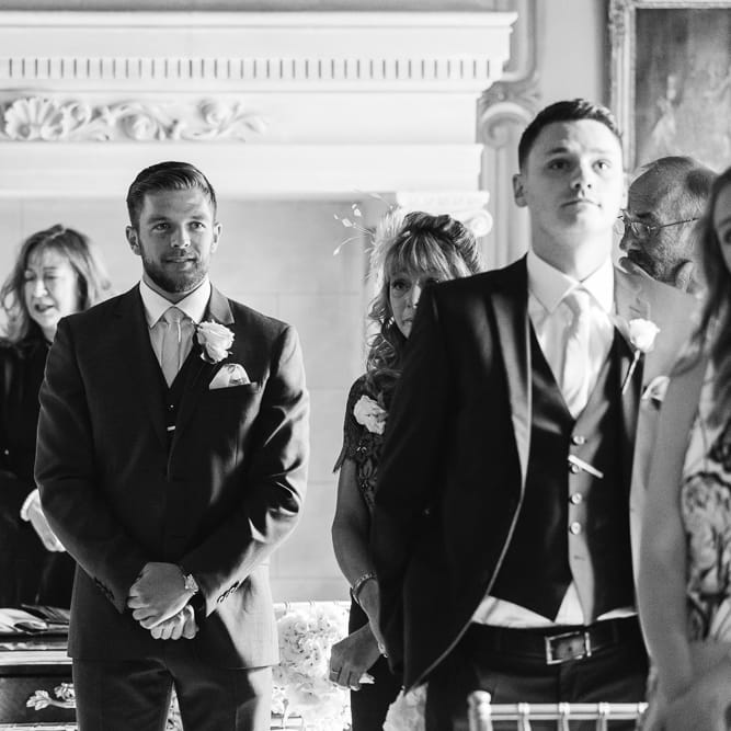 Groom at the Altar in Reiss Navy Three Piece Suit