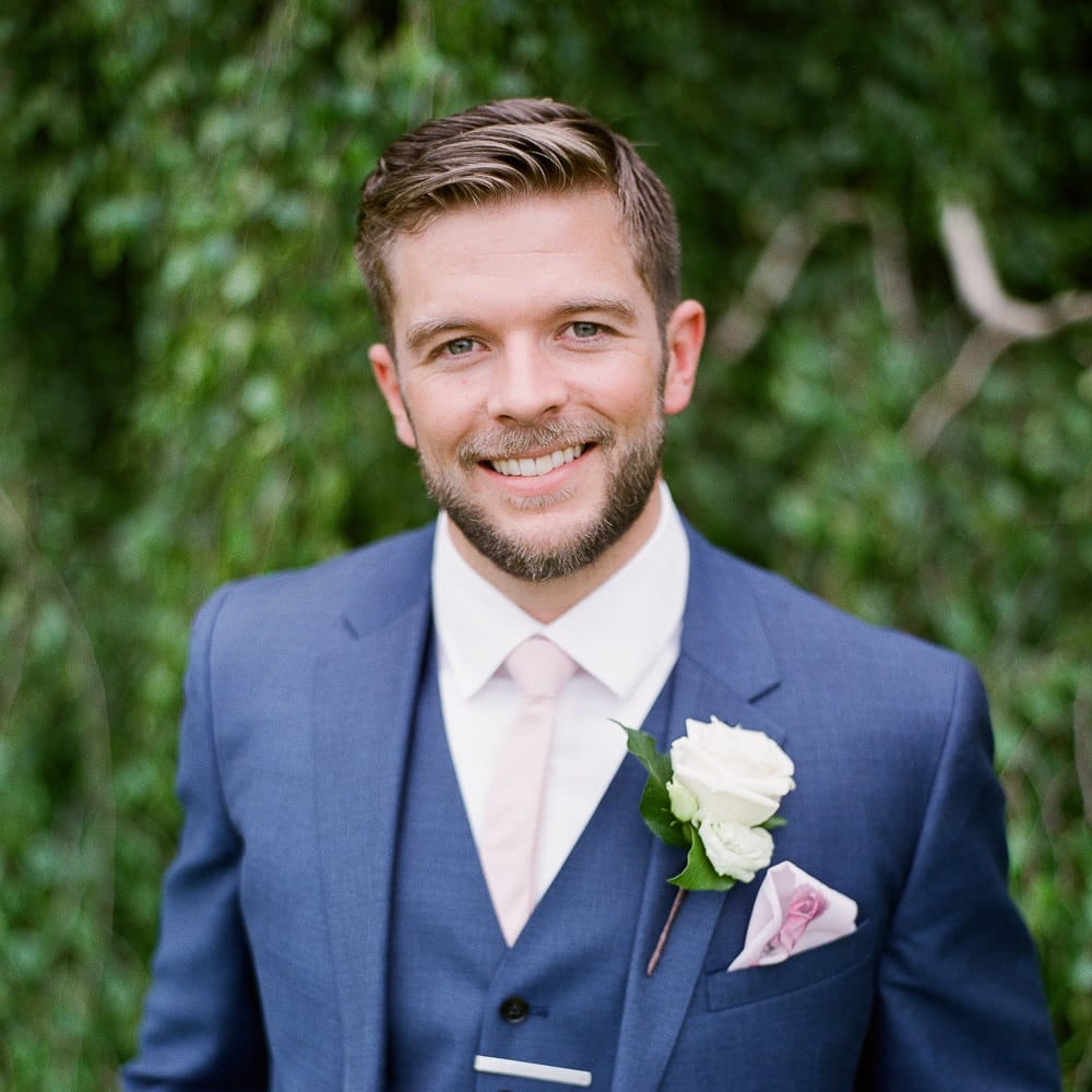 Groom in Reiss Three Piece Navy Suit