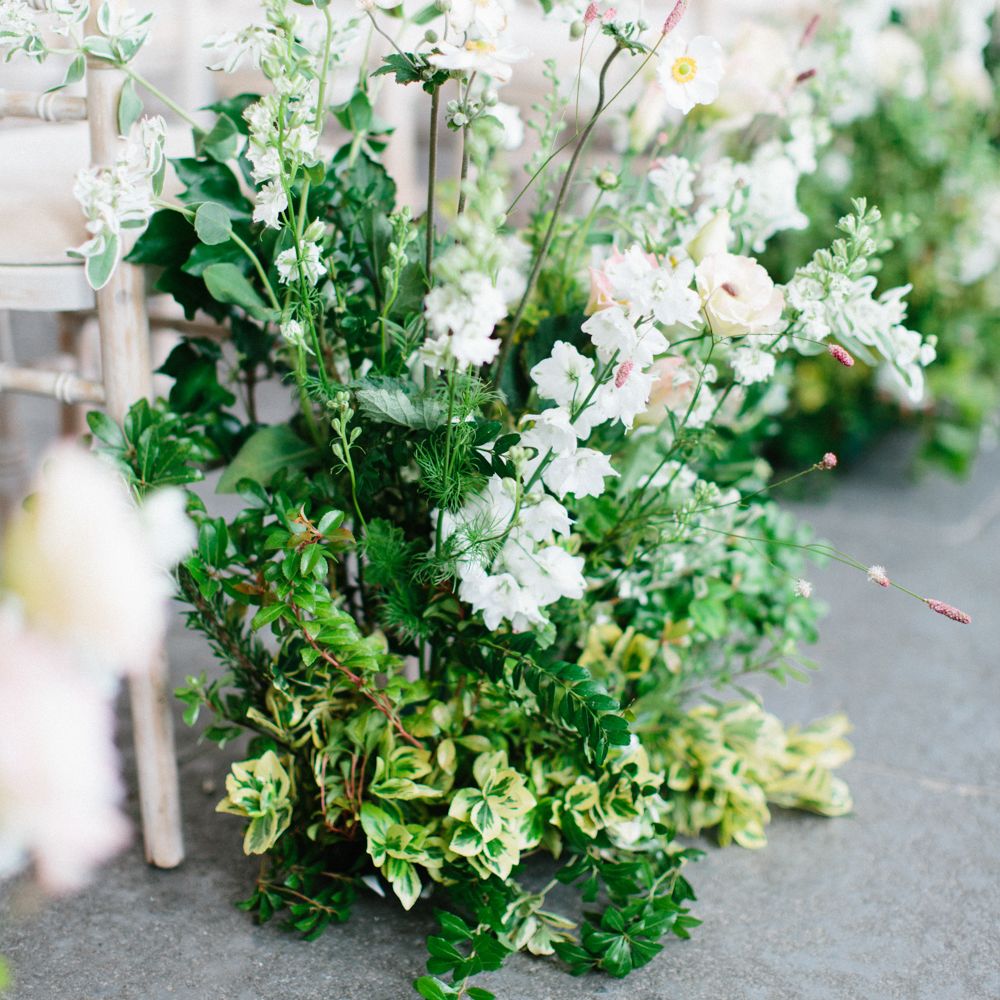 Wedding Aisle Lined With Fresh Flowers by Petalon