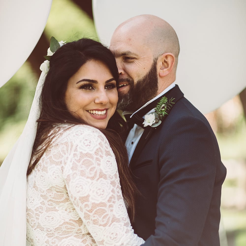 Bride in Grace Loves Lace Wedding Dress | Groom in Tuxedo | Lemonade Pictures