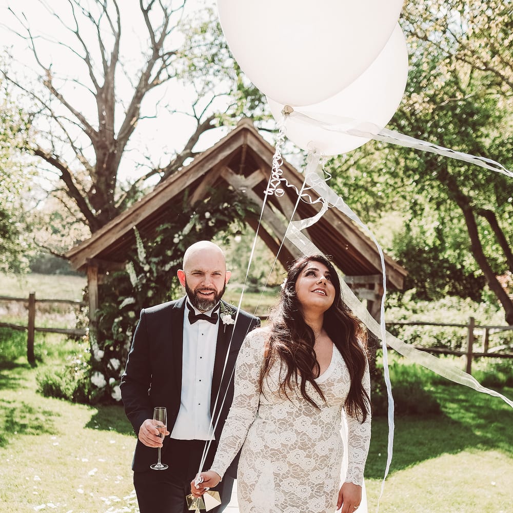 Bride in Grace Loves Lace Wedding Dress | Groom in Tuxedo | Giant Balloons | Lemonade Pictures