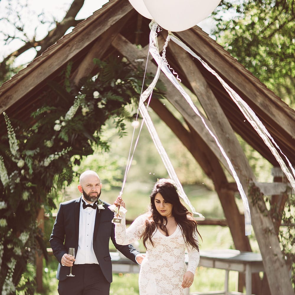 Bride in Grace Loves Lace Wedding Dress | Groom in Tuxedo | Giant Balloons | Lemonade Pictures