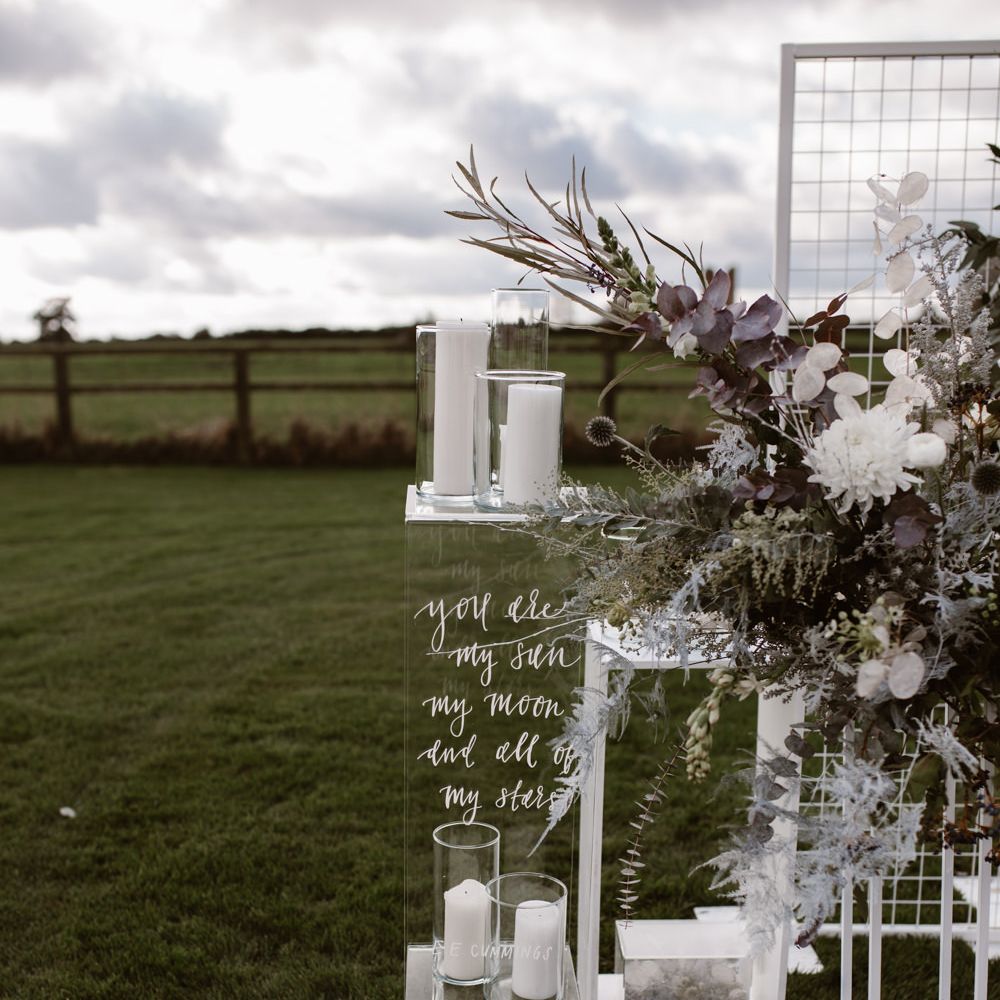 White & Grey Flowers by Swaffham Florist | Etched Perspex Altar Plinths | Nocturn Wedding Inspiration Planned & Styled by The Little Lending Company | Agnes Black Photography | Film by The Wilde Bride