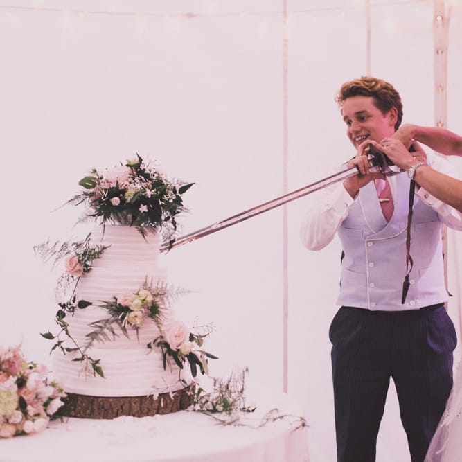 Cutting the Cake with Bride in Monique Lhuillier Candy Wedding Dress