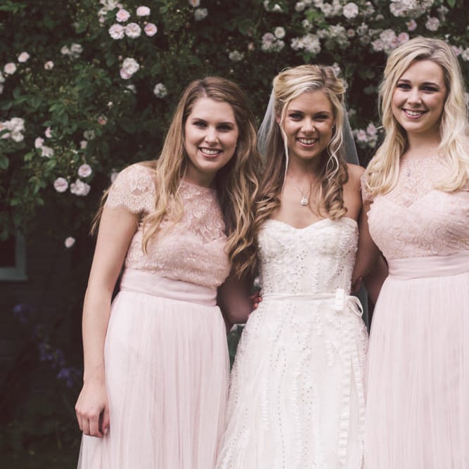 Bride in Monique Lhuillier Candy Wedding Dress & Bridesmaids in Pink BHLDN Dresses