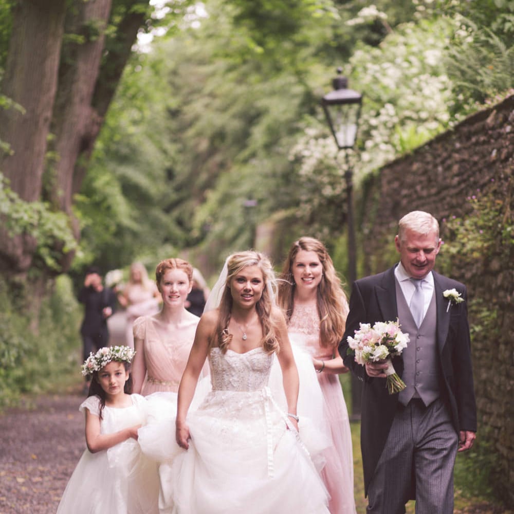 Bride in Monique Lhuillier Candy Wedding Dress & Bridesmaids in Pink BHLDN Dresses