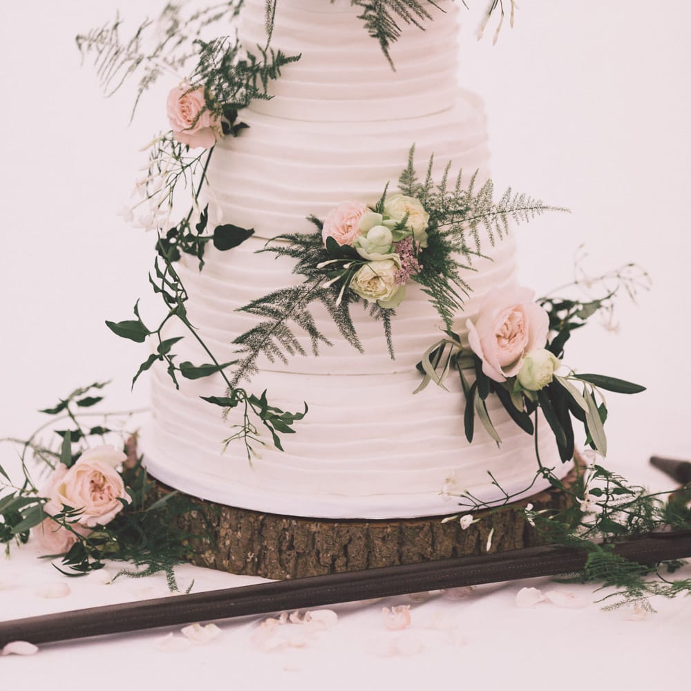Frosted Wedding Cake with Flower Decor